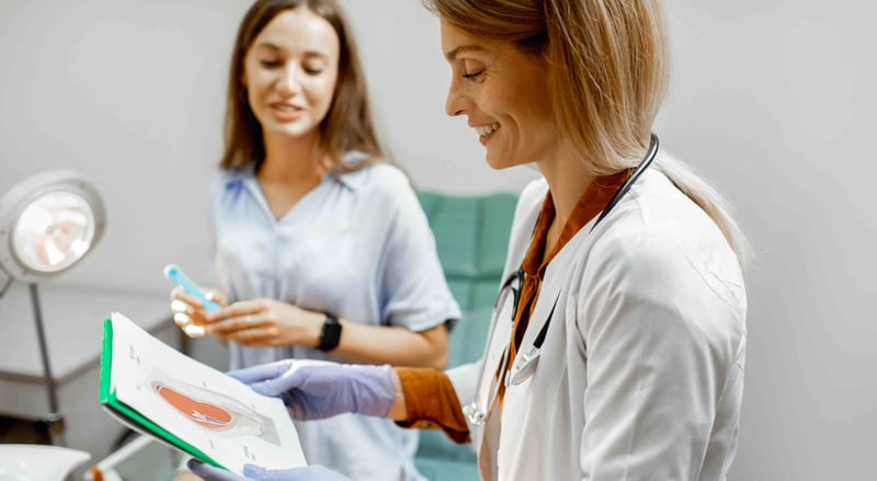 gynecologist-with-female-patient-in-the-office-2023-11-27-04-52-59-utc